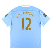 Camiseta Umbro del Manchester City de la temporada 2011-12 de local Campeones #12 *con etiquetas* XXL