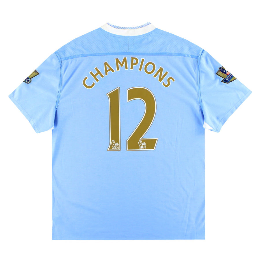 Camiseta Umbro del Manchester City de la temporada 2011-12 de local Campeones #12 *con etiquetas* XXL